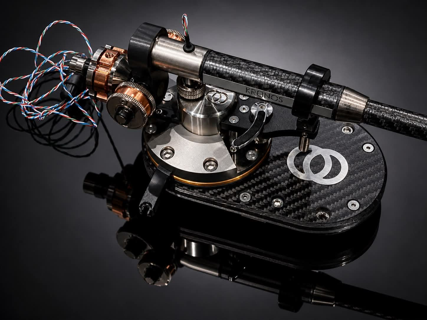 Three-quarter view of the RS tonearm showcasing its suspended pivot architecture.
